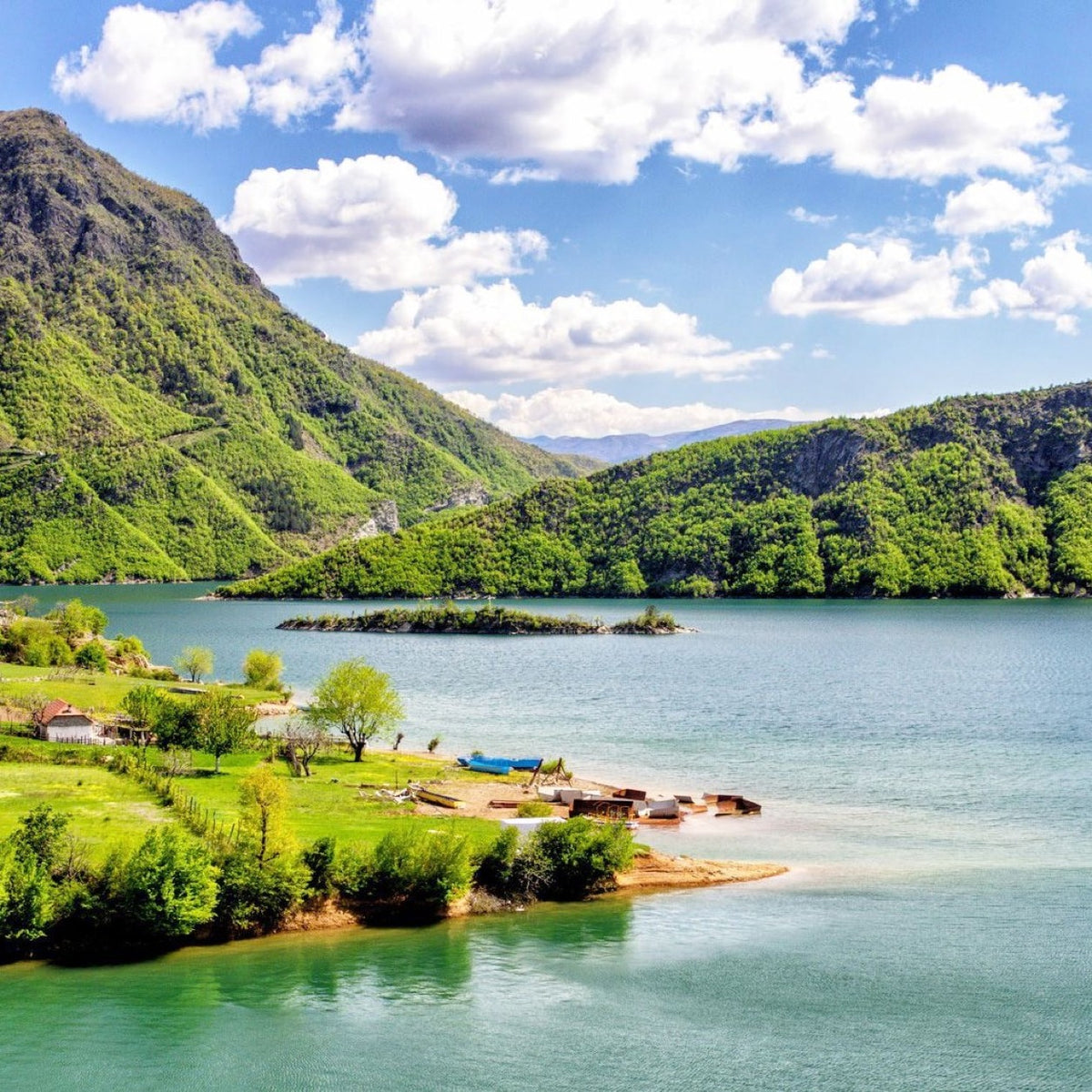 A mountain lake beneath Albanian peaks.